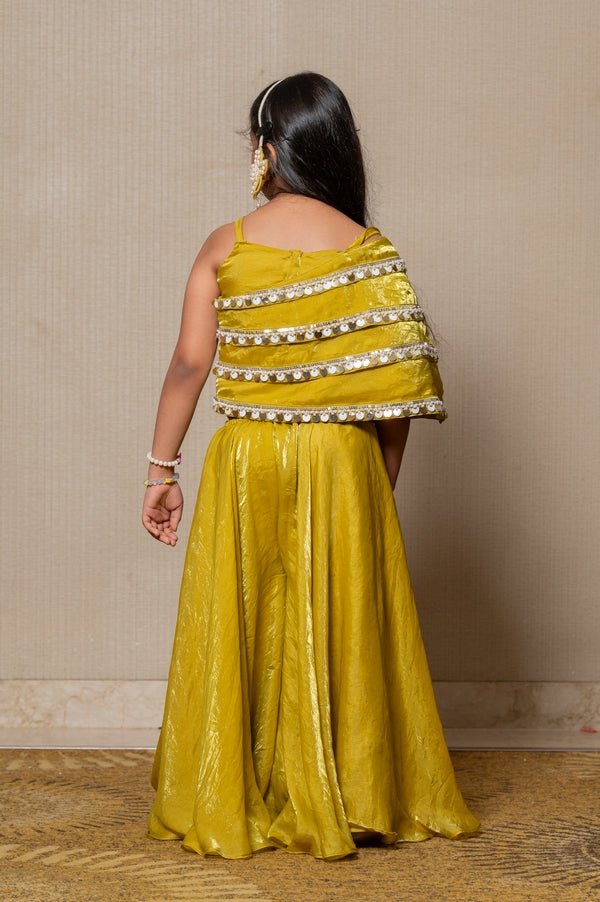 Vibrant golden - yellow ensemble with an asymmetrical top and wide - legged pants, perfect for making a bold statement at any festive occasion. - Kirti Agarwal