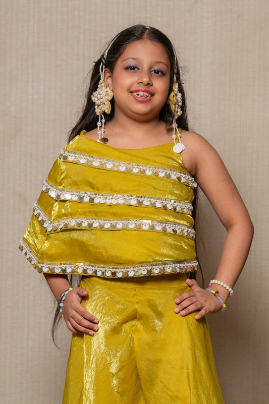 Vibrant golden - yellow ensemble with an asymmetrical top and wide - legged pants, perfect for making a bold statement at any festive occasion. - Kirti Agarwal