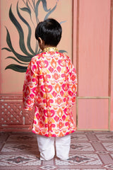 Vibrant printed kurta paired with classic white pyjama, finished with elegant mirror detailing. - Kirti Agarwal