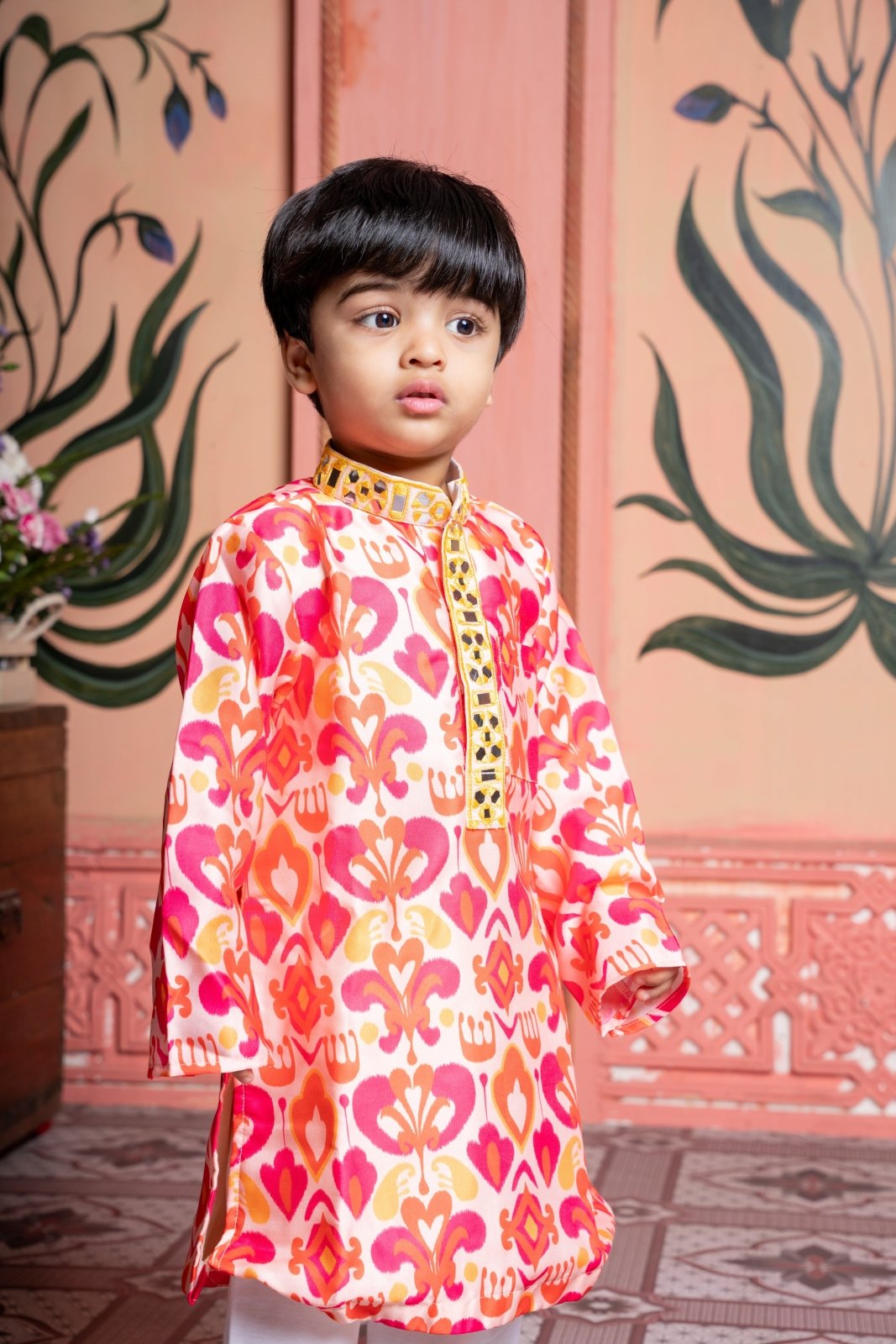 Vibrant printed kurta paired with classic white pyjama, finished with elegant mirror detailing. - Kirti Agarwal