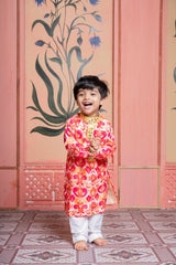 Vibrant printed kurta paired with classic white pyjama, finished with elegant mirror detailing. - Kirti Agarwal